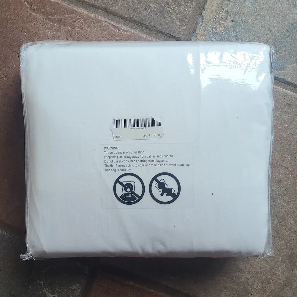 New in bag! King size White Ruffled Duvet Cover and pillow shams
